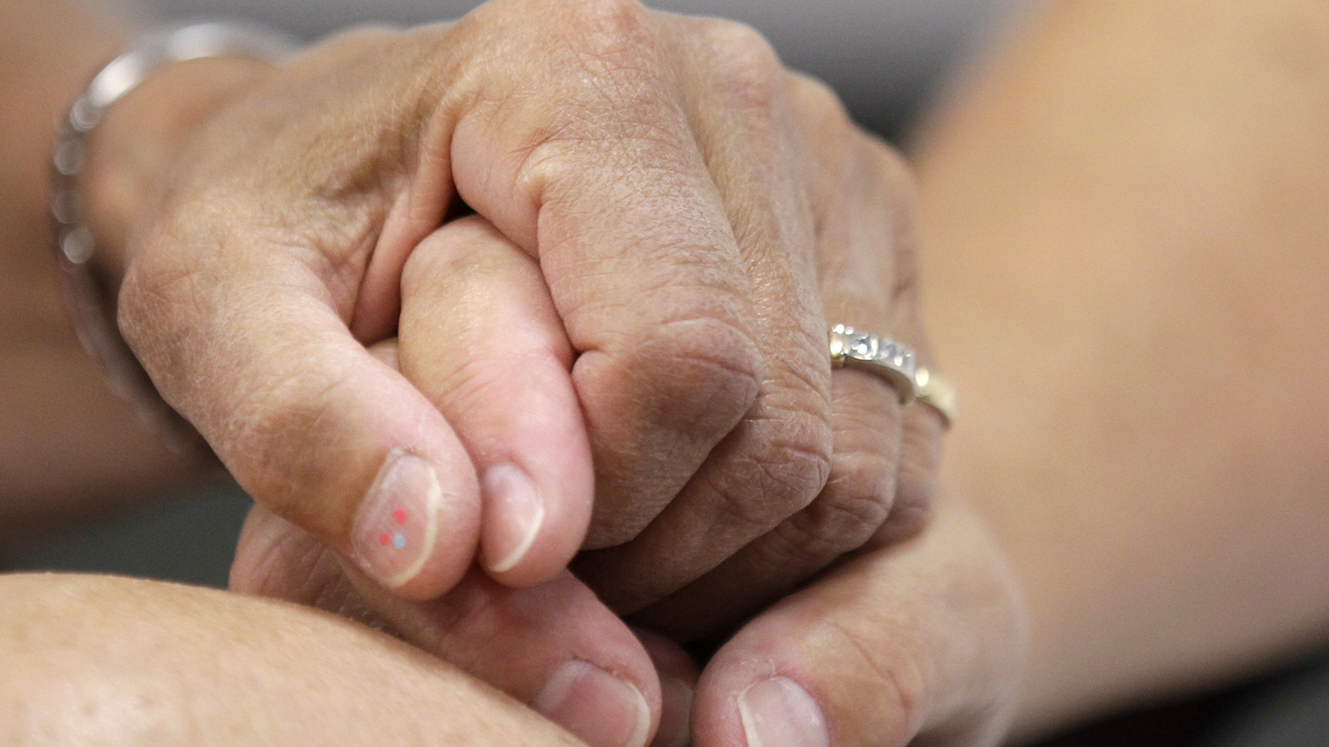  Ellen Toplin and Charlene Kurland hold hands as they obtain a marriage license at a Montgomery County office in July 2013. Even though a judge struck down Pennsylvania's ban on same-sex marriages Tuesday, Montgomery County is still operating under an injunction filed when its register of wills, Bruce Hanes began issuing marriage licenses to same-sex couples last summer. (Matt Rourke/AP Photo) 