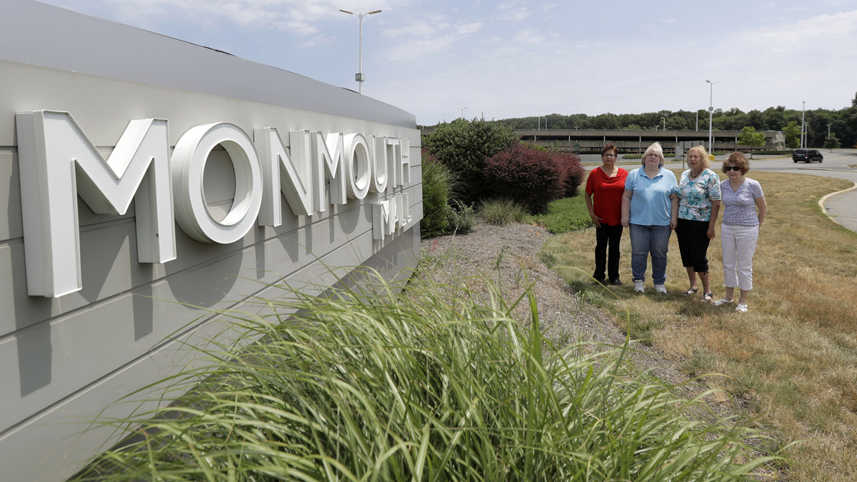  In this Wednesday, July 5, 2017, photo, (from left) Barbara Denegar, Evelyn Guerra, Sara Breslow and Judy Bretzger pose for a picture near the entrance to the Monmouth Mall in Eatontown, N.J. The four women are the plaintiffs in a court case against the town, which they claim gave Kushner Cos. special treatment and sped through approvals for its proposal to build an apartment complex on the mall parking lot. Attorneys for the town and Kushner Cos. say that's not true and that opponents could block the construction of much needed affordable housing. (Julio Cortez/AP Photo) 