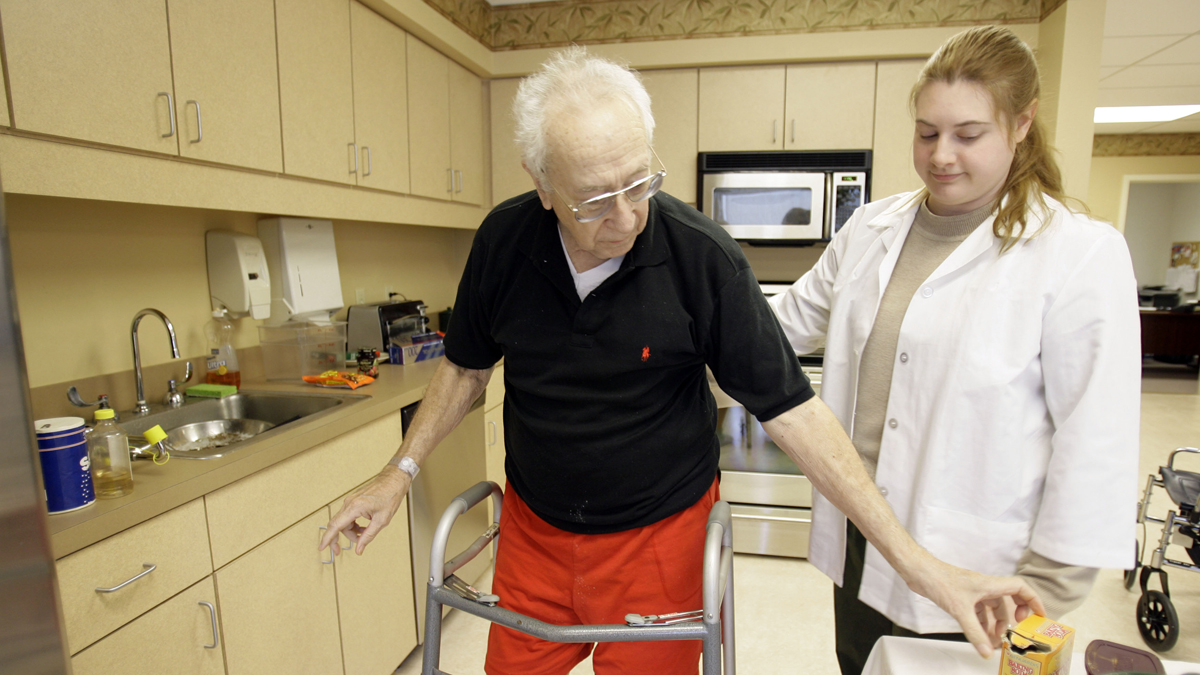  A man works with an occupational therapist during a therapy session in Hatboro, Pennsylvania. (Matt Rourke/AP Photo) 