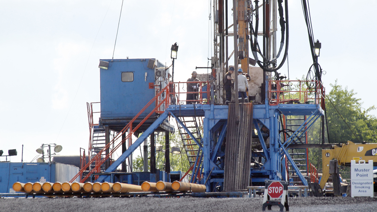   FILE- In this Monday, June 25, 2012, file photo, a crew works on a drilling rig at a well site for shale based natural gas in Zelienople, Pa. U.S. industrial production rose in June as factories made more cars, machines and business equipment. Factory output recovered to levels reached earlier this spring but appears to be leveling off. The Federal Reserve says factory output rose 0.7 percent last month, after falling by the same amount in May. (Keith Srakocic/AP Photo, file) 