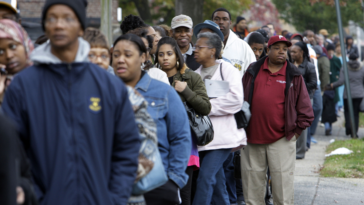 Voters wait in line to cast their votes in Philadelphia
