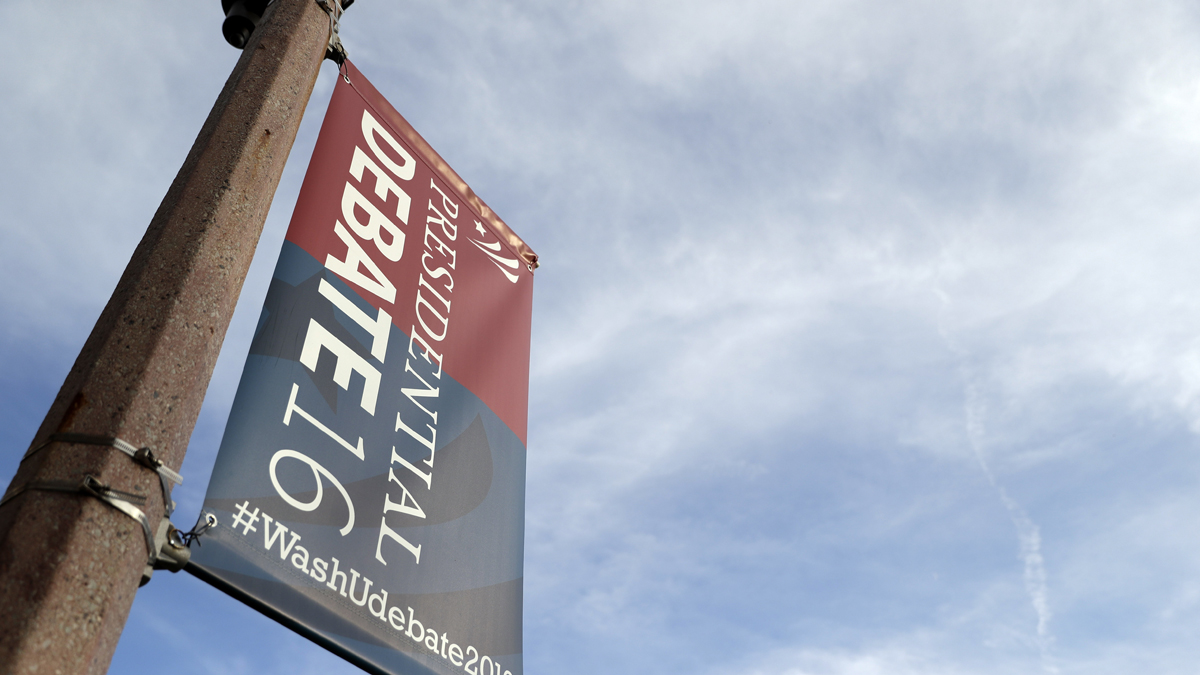  A banner hangs from a light post as preparations continue ahead of the second presidential debate at Washington University in St. Louis, Thursday, Oct. 6, 2016. The town hall debate between Republican presidential nominee Donald Trump and Democratic presidential nominee Hillary Clinton is set for this Sunday. (Jeff Roberson/AP Photo) 