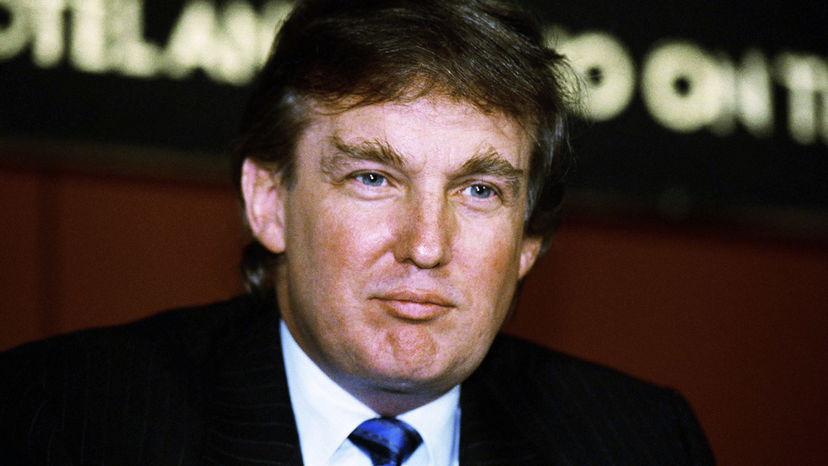 Developer Donald Trump poses for photos outside the New York Stock Exchange after the listing of his stock on Wed.