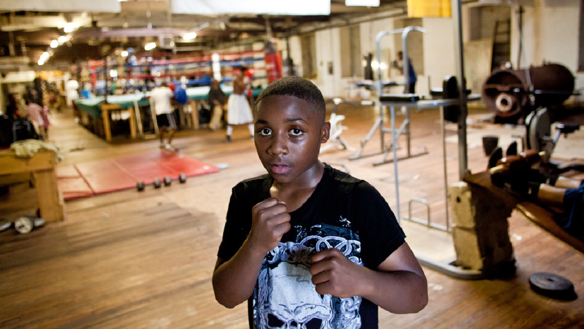  James Barnett, 13, trains at Bozy's Dungeon in East Germantown. He started boxing five years ago by mimicking those he saw in the ring when his older brother was boxing. (Brad Larrison/for NewsWorks) 