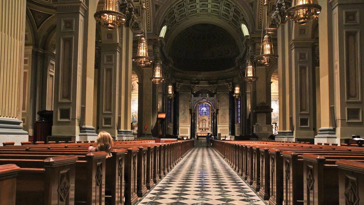  Visitors to the Basilica of Saints Peter and Paul in Philadelphia Friday were happy to hear that Pope John Paul II will be officially canonized as a saint. (Kimberly Paynter/WHYY) 