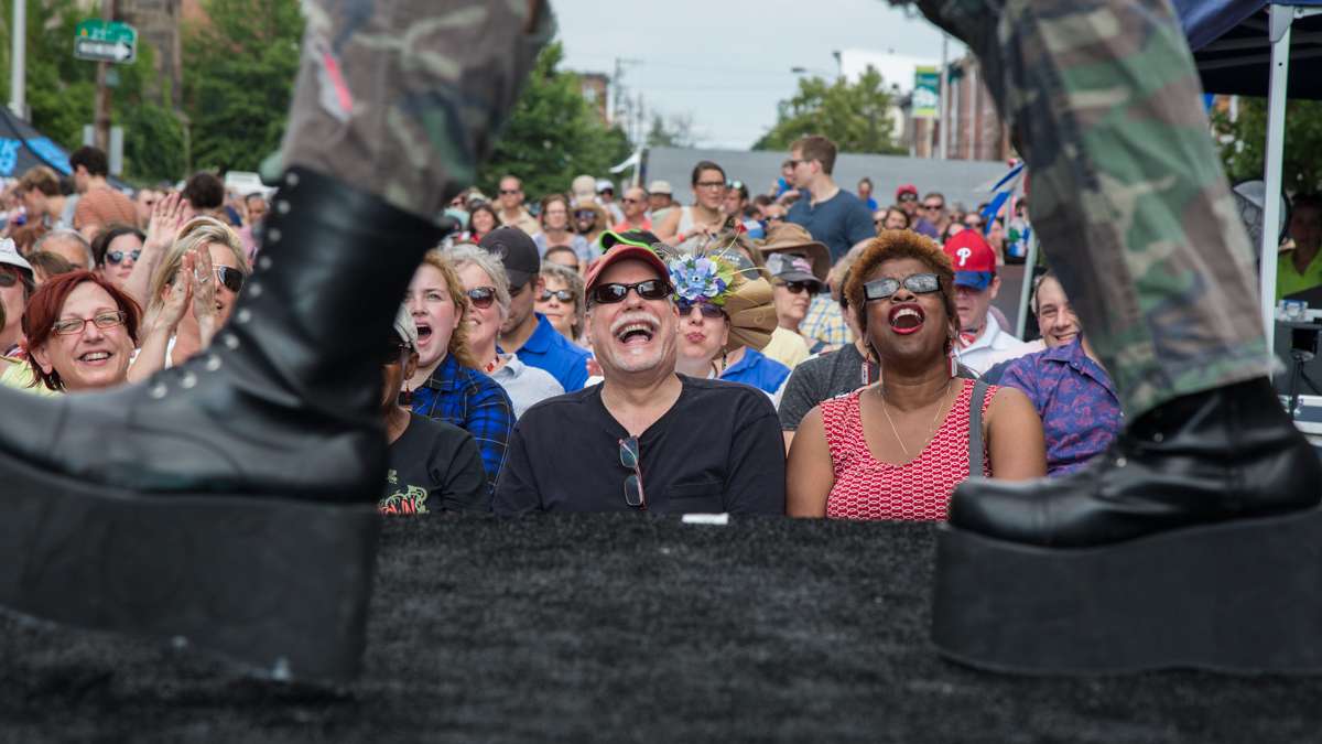 Audience members react to a performance by Attic Youth at the annual Bastille Day celebration at Eastern State Penitentiary