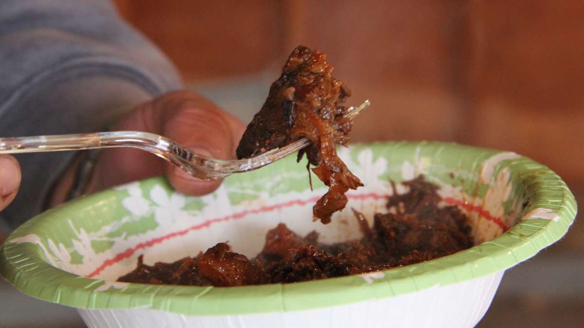At Green Pond, check point workers lunch on bear meat from last year's harvest. Bear meat is fatty, something like corned beef, said one. (Emma Lee/for NewsWorks)