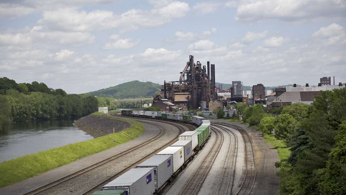 A cargo train rolls by the blast furnaces of the former Bethlehem Steel Co. plant as seen from the Fahy Bridge in Bethlehem, Pa. (Lindsay Lazarski/WHYY)