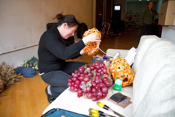 <p><p>Designer Carey Clouse examines one of the birdhouses at Next City's Storefront for Urban Innovation in Philadelphia. (Lindsay Lazarski/WHYY)</p></p>
