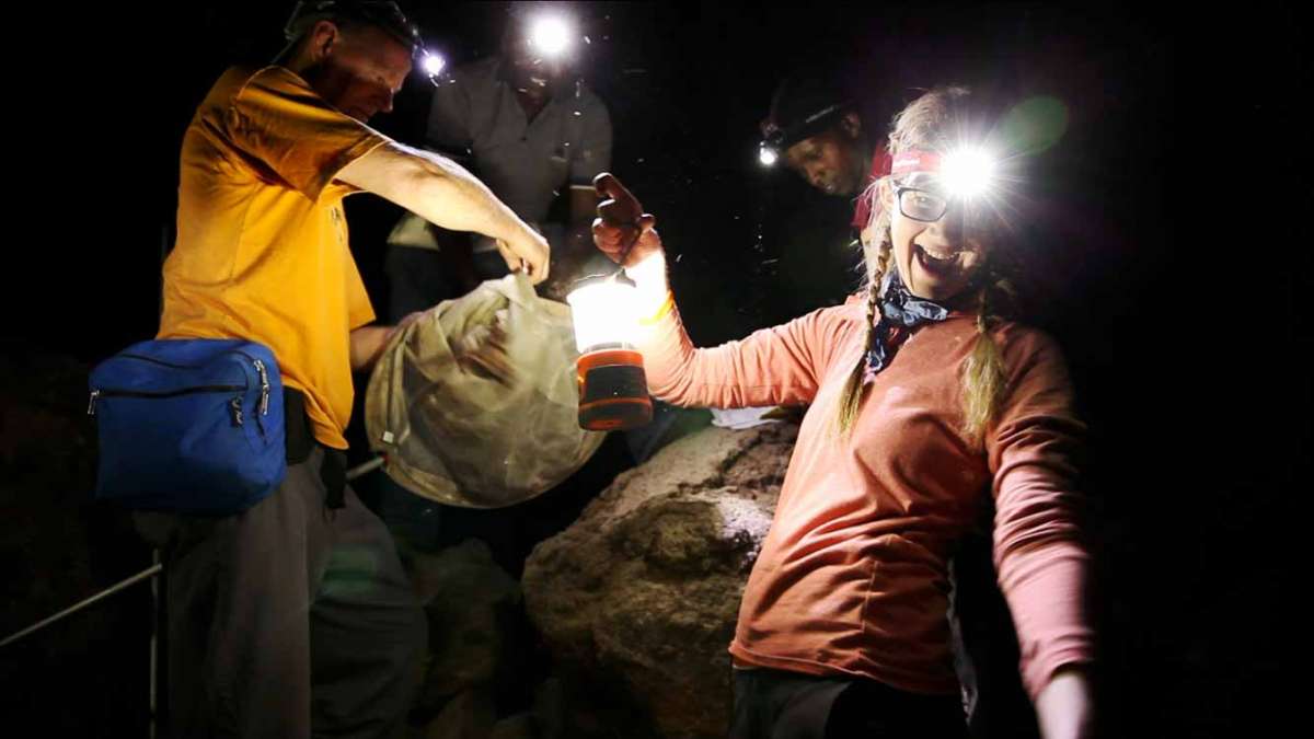 Emily Graslie in a Cave in Kenya.  (Courtesy of Greg Mercer of the Field Museum)