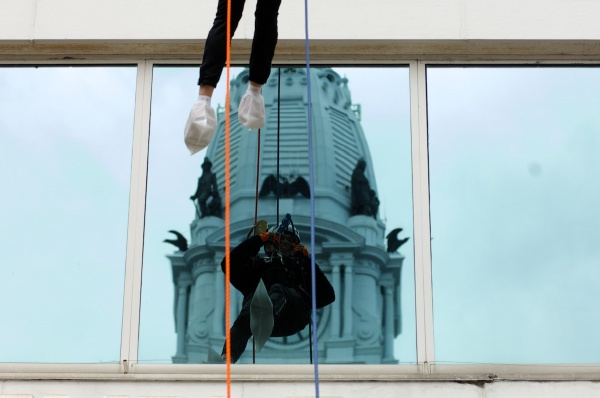 <p><p>City Hall is seen behind the reflection of a rappeller. (Bas Slabbers/for NewsWorks)</p></p>

