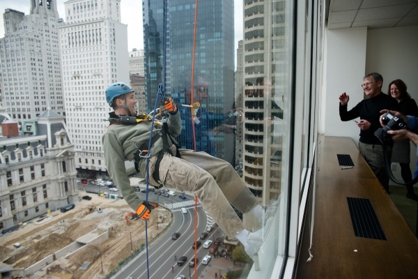 <p><p>A window in an office on the 16th floor gives a good view of one rappeller. (Bas Slabbers/for NewsWorks)</p></p>
