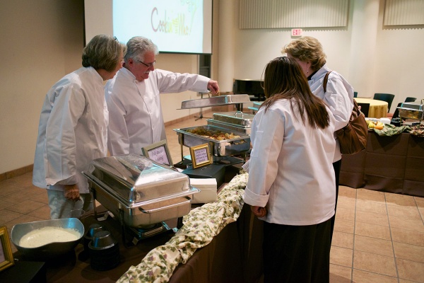 <p><p>Three participating chefs check out the dish prepared by last year's winner Rabbi George Stern. (Bas Slabbers/for NewsWorks)</p></p>
