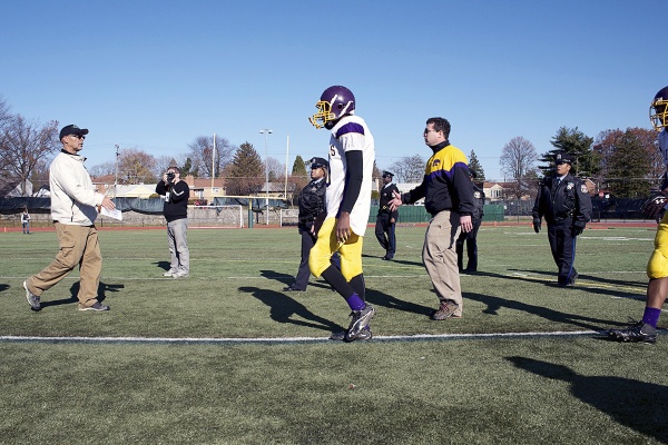 <p><p>Germantown Coach Michael Hawkins (left) shakes hands with the team's Thankgiving rivals after the game. (Bas Slabbers/for NewsWorks)</p></p>
