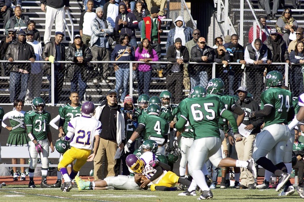 <p><p>Germantown's defense stops an MLK play in front of coach, teammates and fans. (Bas Slabbers/for NewsWorks)</p></p>
