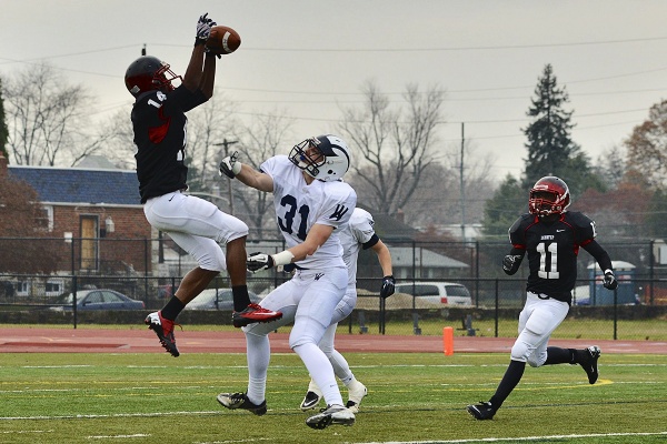 <p><p>Khalil Steward, a senior wide receiver, corrals a reception despite Scott McAvoy's coverage. (Bas Slabbers/for NewsWorks)</p></p>
