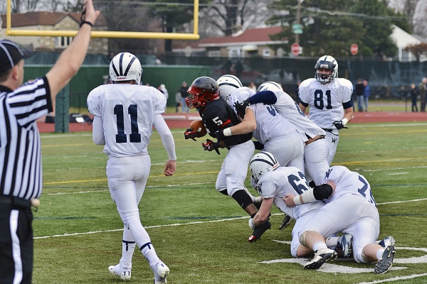 <p><p>It took four Spartans to tackle Imhotep's DeAndre Scott, who scored a touchdown in the game. (Bas Slabbers/for NewsWorks)</p></p>
