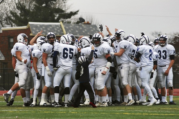 <p><p>A youngster tries to get in on the action as the Wyomissing Spartans huddle up before the start of the PIAA state semifinal game against Imhotep. (Bas Slabbers/for NewsWorks)</p></p>
