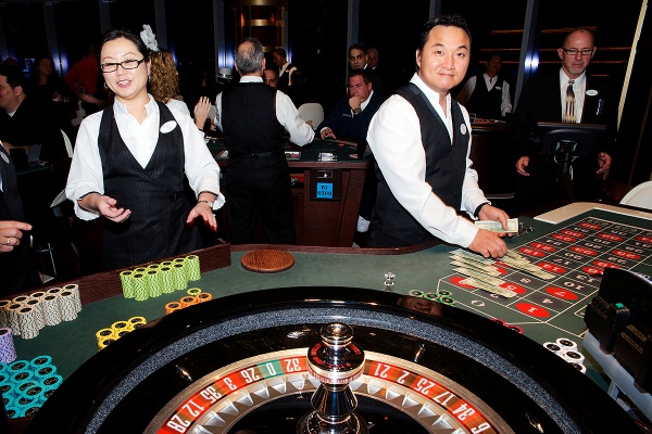 <p>Dealers at work at one of the tables of the Revel Casino. (Bas Slabbers/for NewsWorks, file)</p>
