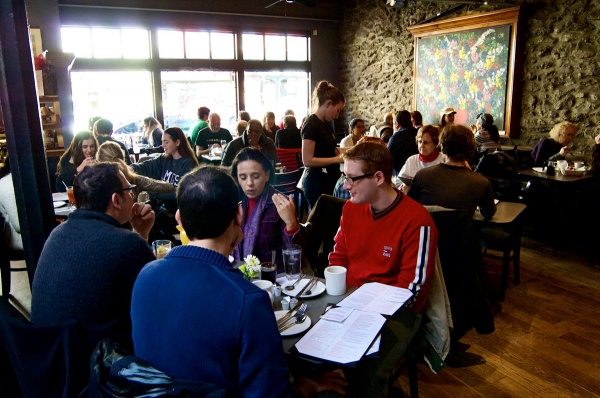 <p><p>Customers of Winnie's Le Bus enjoy lunch along Main Street during the Saturday festival. (Bas Slabbers/for NewsWorks)</p></p>
