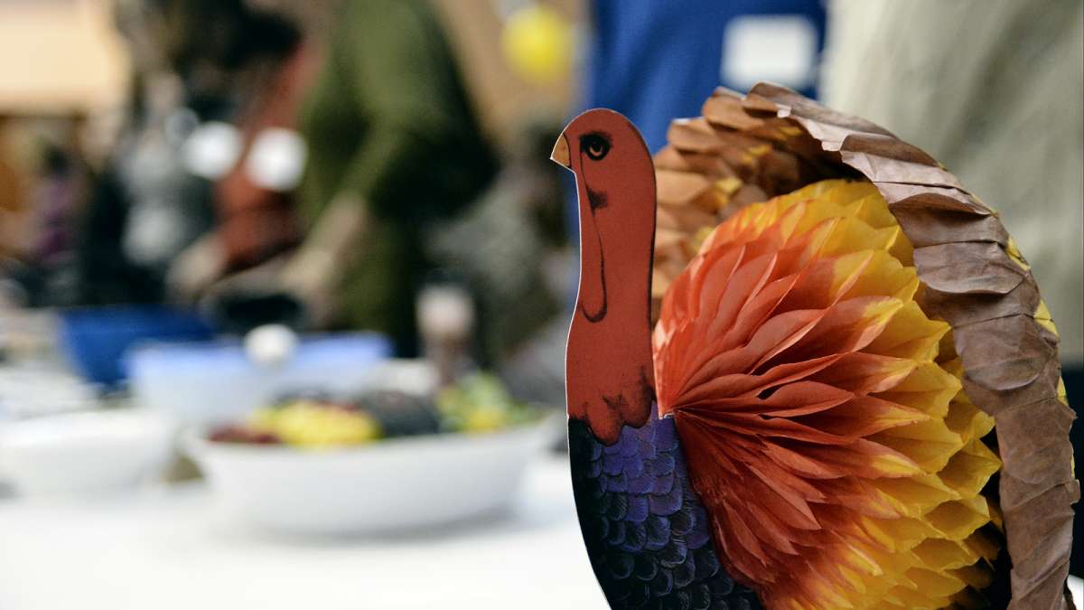 Refugees from all over the world enjoy their first Thanksgiving dinner at the Old Pine Community Center on Sunday. (Bastiaan Slabbers for NewsWorks)