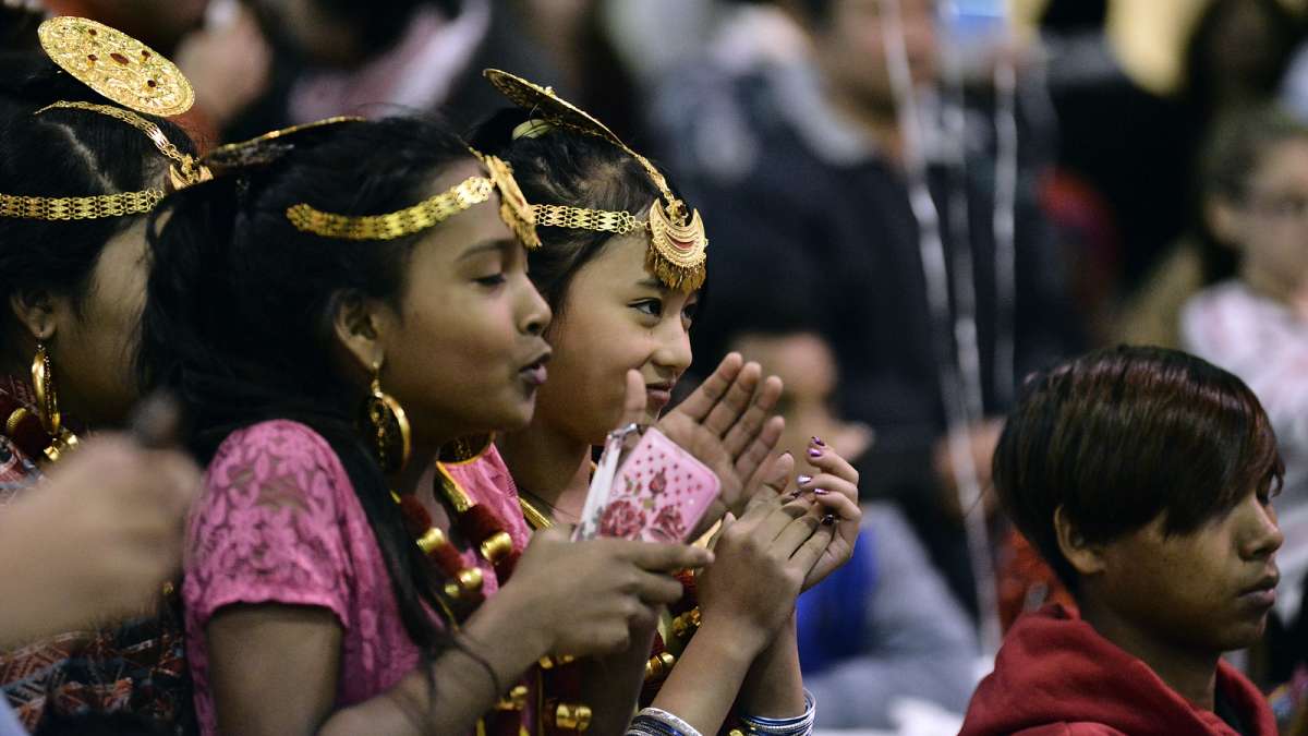 Refugees from all over the world enjoy their first Thanksgiving dinner at the Old Pine Community Center on Sunday. (Bastiaan Slabbers for NewsWorks)