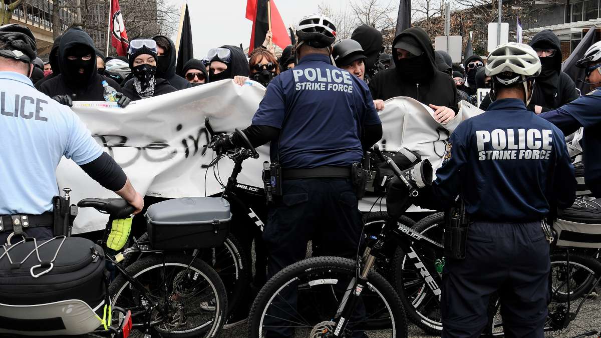  Anti-Trump activists from Antifa Philadelphia (anti-fascist group) are blocked from marching around Independence Mall while a pro-Trump rally is taking place  (Bastiaan Slabbers for NewsWorks) 
