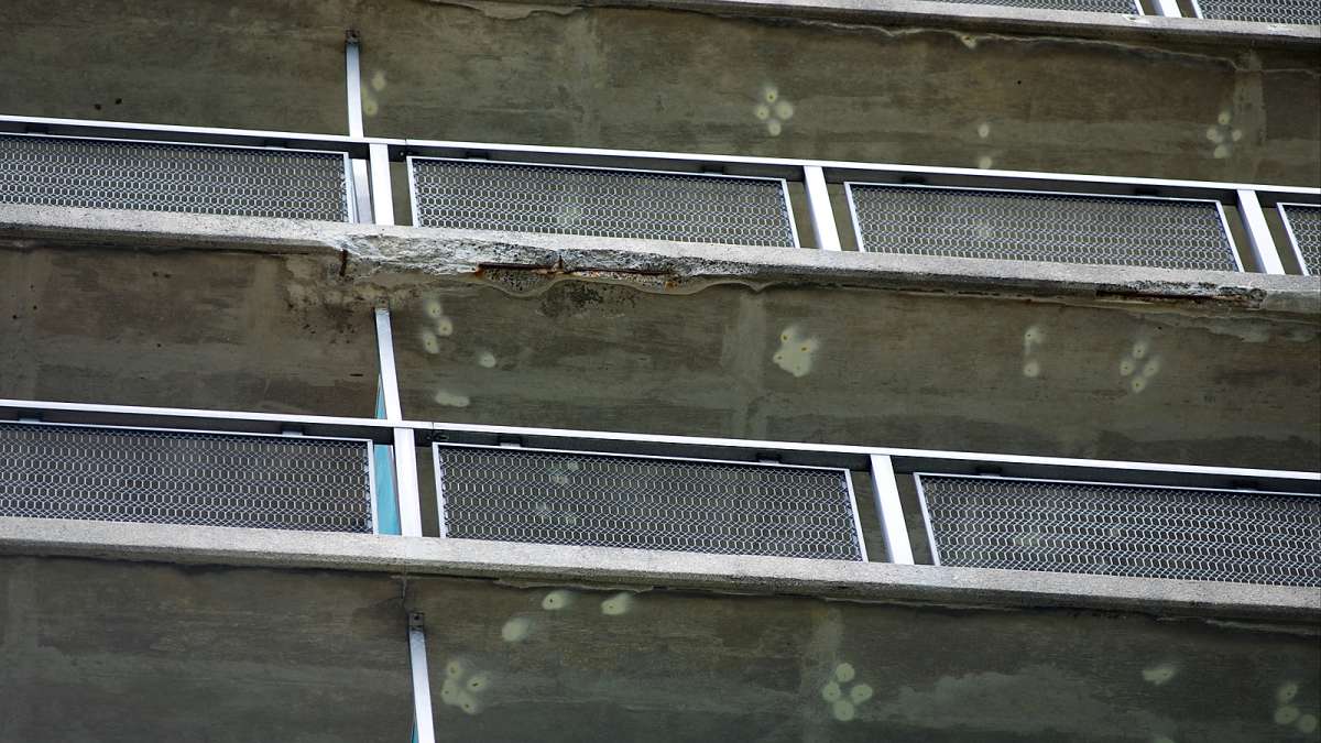 Upwards view shows exposed concrete at one of the balconies at Penn Wynn House.