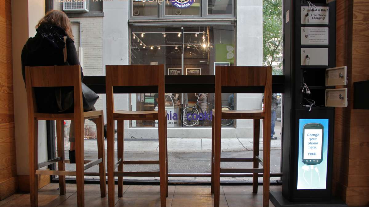 Customers at Honeygrow in Center City can charge their cell phones while they dine using one of Doug Baldasare's kiosks. (Emma Lee/for NewsWorks)