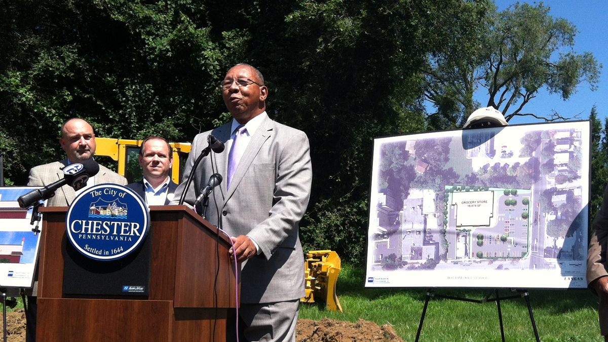  Chester Mayor John Linder join other government and business leaders to celebrate the groundbreaking of a new grocery store, Bottom Dollar, at 15th and Edgemont streets, expected to open early next year. The city hasn’t had a grocery store in over a decade. (Elana Gordon/WHYY) 