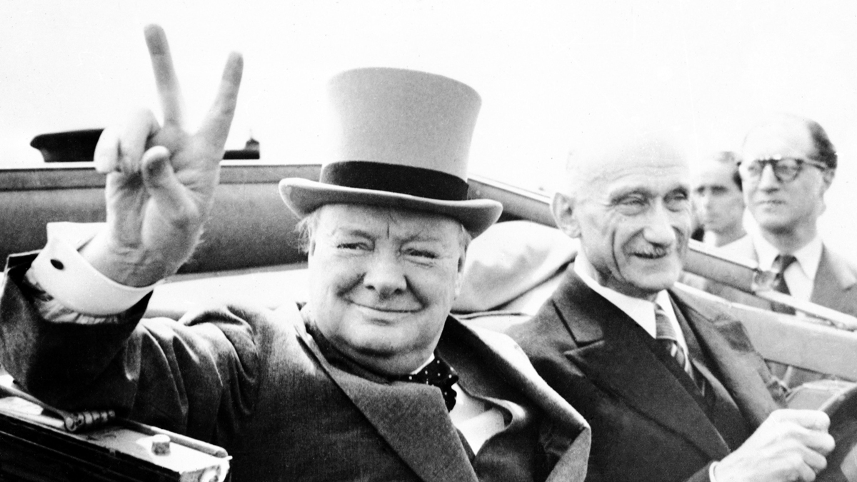  Former British Prime Minister Winston Churchill, gives his famous V-sign, as he drives through cheering inhabitants of the town of Metz, in France, on July 14, 1946. (AP Photo) 