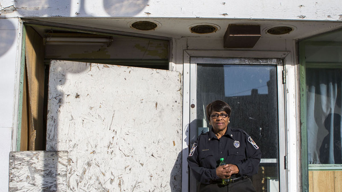  Longtime Clairton resident Donna Hudson stands in the doorway of what was her favorite childhood ice cream shop, Nettie’s Place on Miller Avenue. (Jessica Kourkounis/For Keystone Crossroads) 