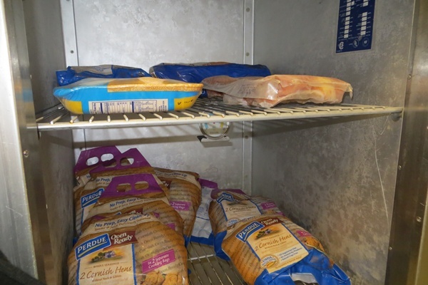 <p><p>The food pantry at Eisenberg Elementary School offers families proteins, like chicken and cornish hens (Shirley Min/WHYY)</p></p>
