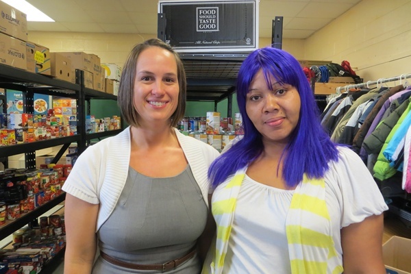 <p><p>Food pantry organizer, Molly Perdue, left, is Eisenberg Elementary's family crisis therapist. Chiante Green on right says food pantry has helped her family tremendously. (Shirley Min/WHYY)</p></p>

