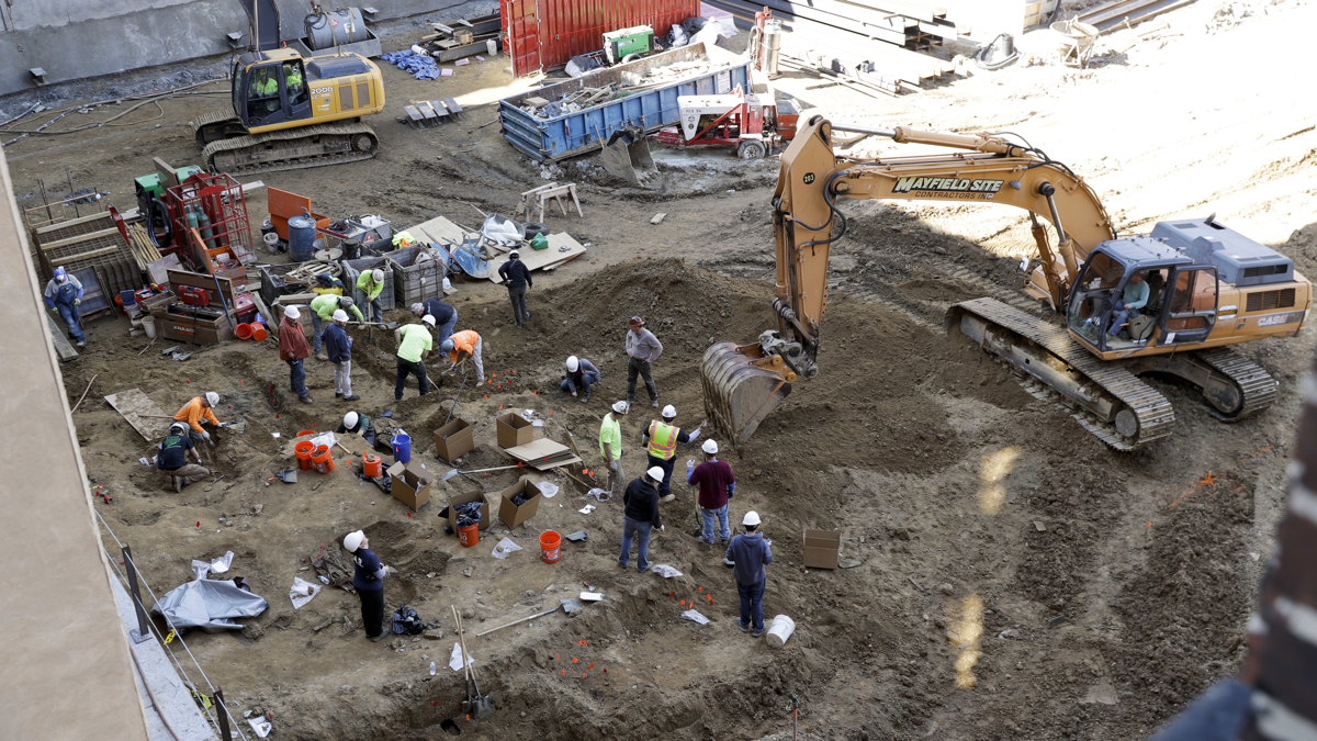 Workers excavate coffins from a construction site in the Old City neighborhood March 9 in Philadelphia.   (Matt Slocum/AP Photo) 