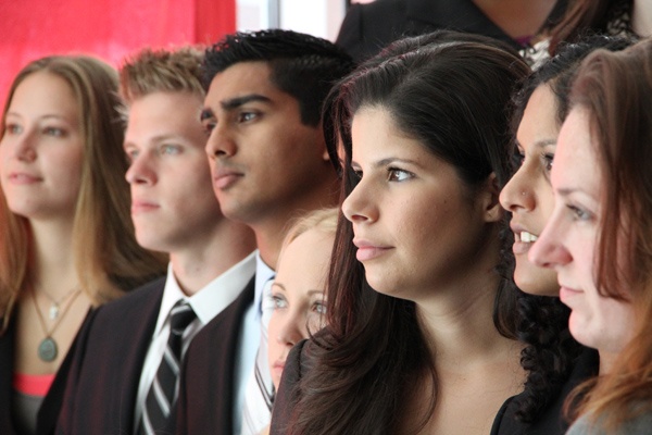 New medical students listen to the instructions of the dean during orientation for the first class at Cooper Medical School in Camden. (Emma Lee/for NewsWorks)