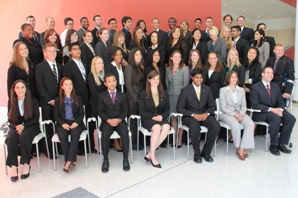 The 50 members of the inaugural class at Cooper Medical School in Camden sit for class photos during orientation. (Emma Lee/for NewsWorks)