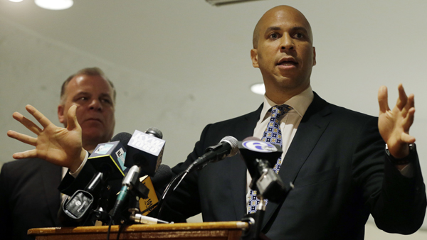  N.J. Senate President Stephen M. Sweeney listens, as Senate candidate Newark, N.J., Mayor Cory Booker (foreground) addresses a gathering of supporters at an event in Deptford Township. (AP Photo/Mel Evans, file) 