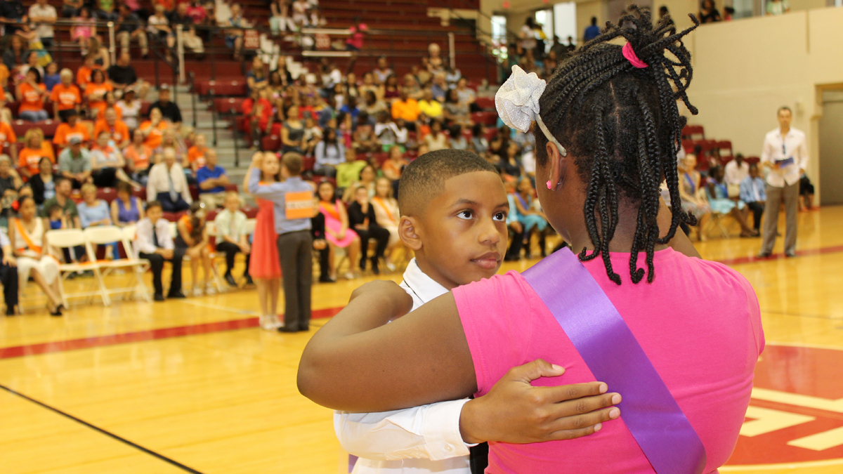  Ballroom dancing is a serious art form, so intensity and courtesy, including looking at your partner squarely in the eyes is important for this pair of Violet team dancers from the Russell Bayard Charter School. (Elisabeth Perez-Luna/WHYY) 