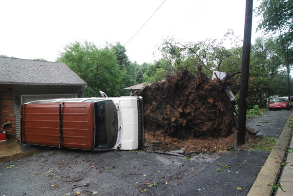 A large tree smashes into the Pazdalski home in Edgemoor. It took out the family van as well. (John Jankowski/for NewsWorks) 