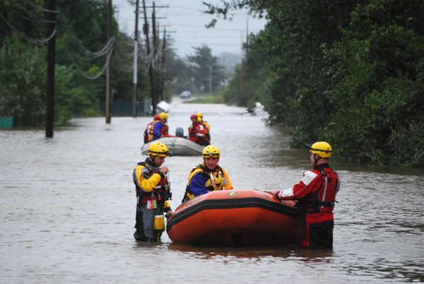 Teams went out in the swollen Christiana River Sunday looking for people who might be stranded from the flooding caused by Hurricane Irene. (John Jankowski/For Newsworks)