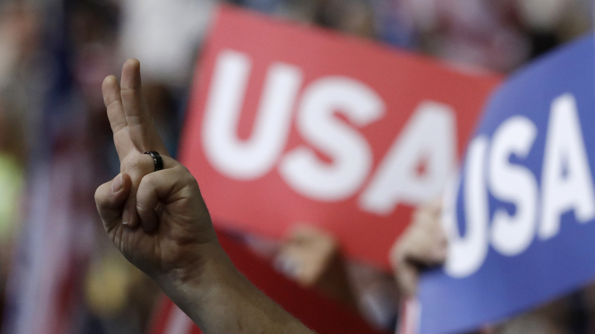 A delegate flashes a peace sign during the final day of the Democratic National Convention in Philadelphia