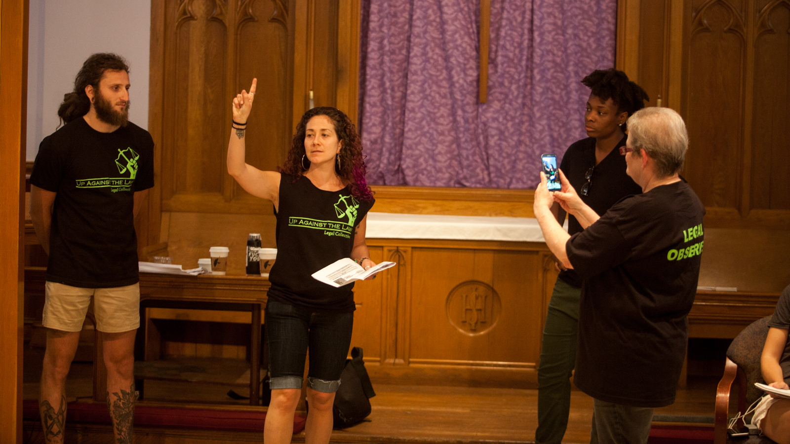 Members of Up Against the Law Legal Collective demonstrate to 