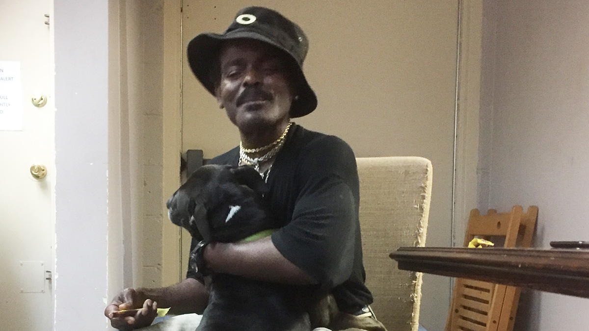  Rob Roy visits his dog Mocha every Saturday at Faithful Friends. (Zoe Read/WHYY) 