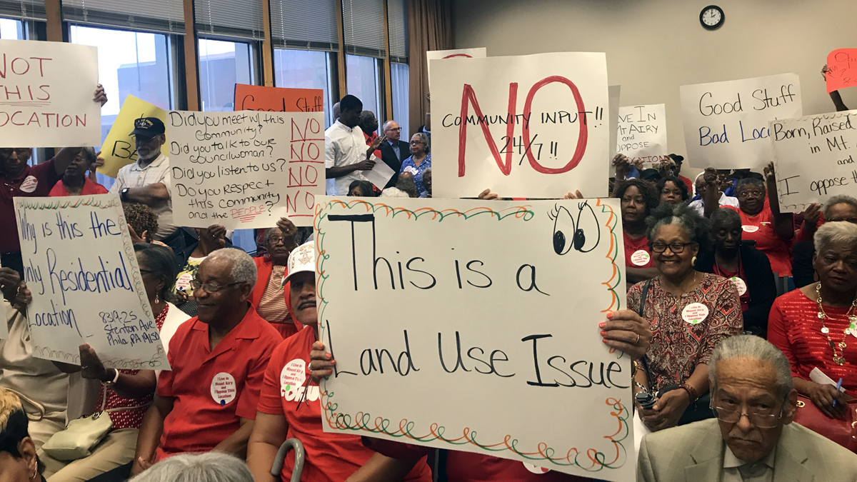  Mt. Airy residents are shown attending a community meeting on Aug. 15. (Bobby Allyn/WHYY) 