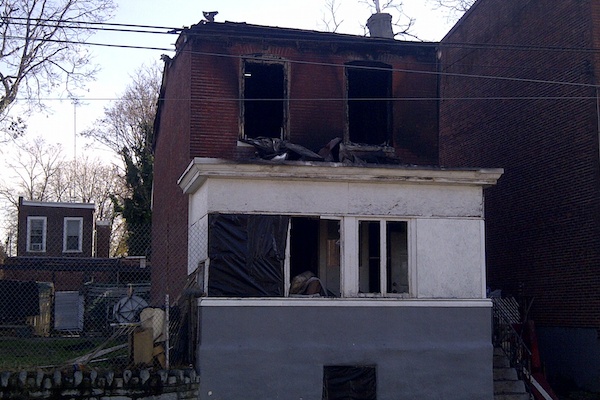 <p><p>Fire officials said a woman was found dead in a second-floor bedroom while another victim was transported to an area hospital where he would be pronounced dead later Wednesday morning. (Brian Hickey/WHYY)</p></p>
