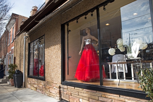 Mia's of Philadelphia at Moore Street and East Passyunk Avenue displays prom dresses in the boutique windows. (Lindsay Lazarski/WHYY)