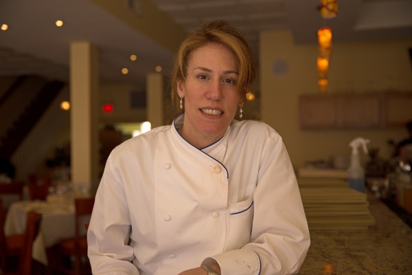 Paradiso chef and owner Lynn Rinaldi uses produce grown in the restaurant's rooftop garden on East Passyunk Avenue in South Philadelphia. (Lindsay Lazarski/WHYY)