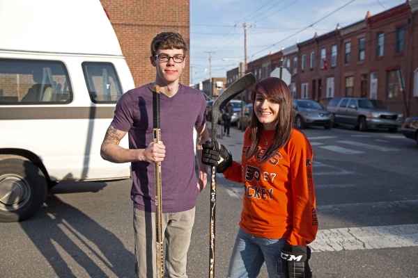 Chelsea DeRock (right), with friend Craig Doughty, says that East Passyunk has become more culturally diverse compared to the Italian neighborhood she remembers as a young girl. (Lindsay Lazarski/WHYY)