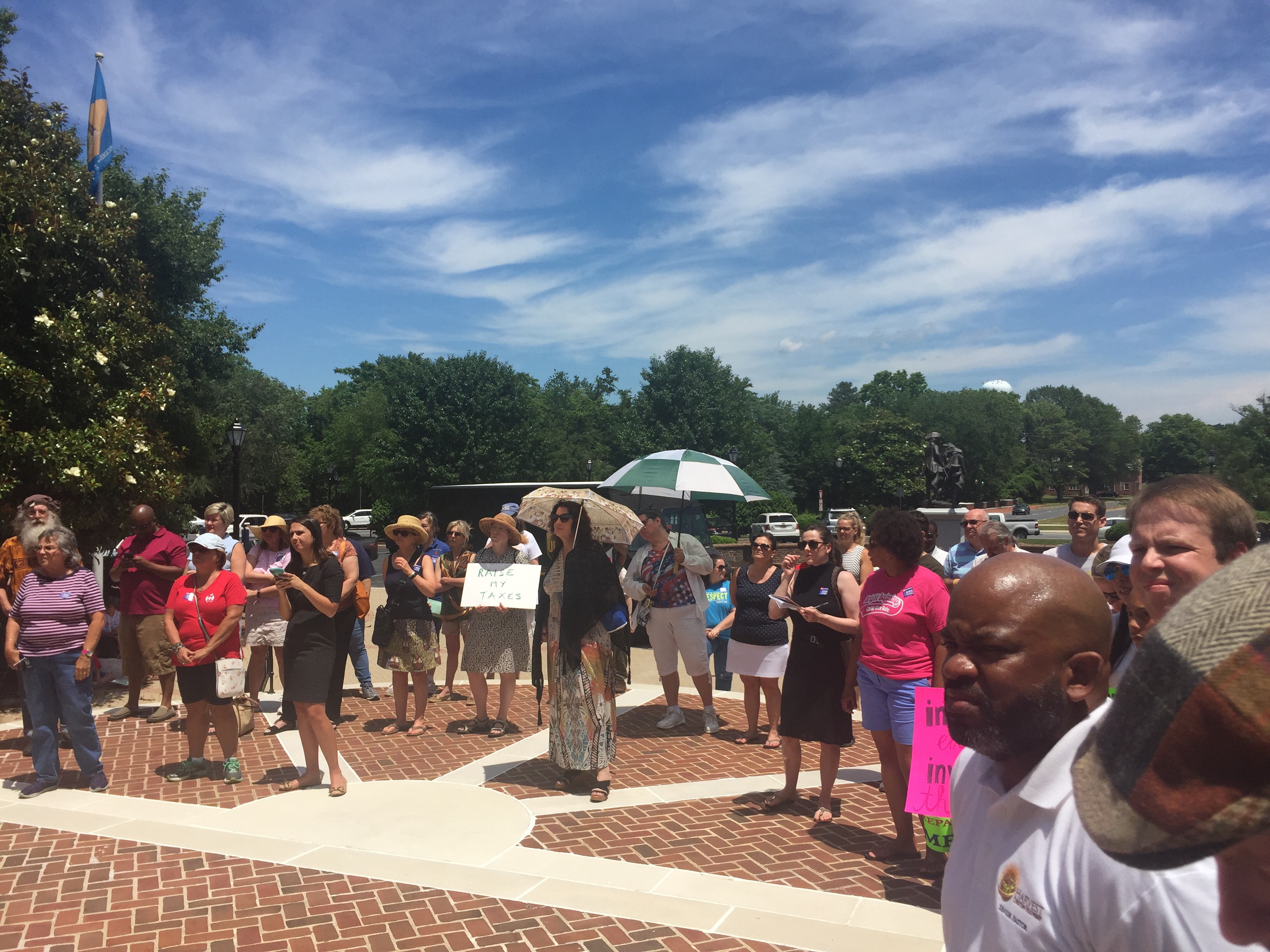  Protesters of Gov. John Carney's proposal to cut education funding by $37 million are calling on lawmakers to consider a bigger income tax increase than they are already mulling. (Cris Barrish/WHYY) 